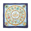 Hermès Carré 90 navy and light blue silk scarf with gold laurel wreath border, star pattern, central chariot motif, and circular European emblem crests, laid flat