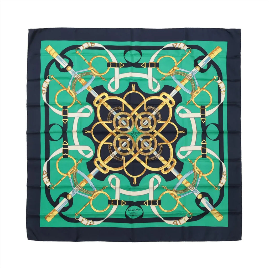 Navy and green Hermès Carré 90 silk scarf with symmetrical gold, white and blue equestrian straps, rings and riding hardware motifs.