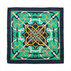 Navy and green Hermès Carré 90 silk scarf with symmetrical gold, white and blue equestrian straps, rings and riding hardware motifs.