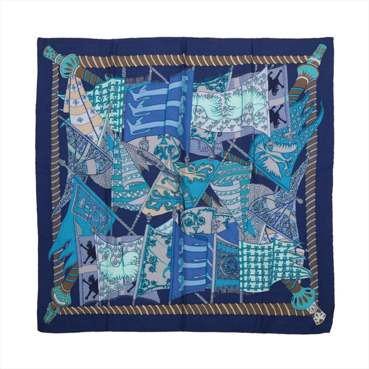 Hermès navy blue cashmere-silk scarf with layered turquoise, pale blue and white flags, ornate patterns and a striped rope border.