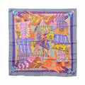 Hermès square scarf laid flat, with overlapping multicoloured banners, decorative motifs, a purple patterned frame and a grey outer border.