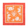 Hermès Carré 90 orange silk scarf with white Ex-Libris carriage and emblem illustration, framed by a red-orange border and cream inner border.