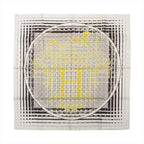 Hermès Carré 90 silk handkerchief featuring the "Faubourg Seconde" design in yellow, black, and white, with layered architectural motifs, grid lines, and an ornate central "H" emblem framed by a circular border.