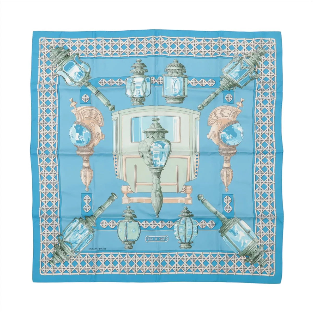 Hermès Carré 90 "FEUX DE ROUTE" silk scarf in blue with ornate carriage lanterns, a vintage coach, and a geometric border.