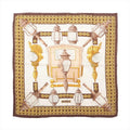Hermès Carré 90 brown and ivory silk scarf with ornate carriage lanterns, gold lattice borders and a central horse-drawn coach motif.