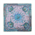 Hermès Carré 90 silk scarf with purple background, blue floral center motif, and multicolor botanical border pattern