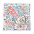 Hermès Carré 90 silk scarf with multicolor floral patchwork design in red, blue, green, and gray tones, finished with a thin pink border on white background