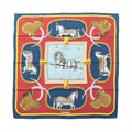 Hermès Carré 90 navy and red silk scarf with “Grand Apparat” horse and harness illustration, gold saddle motifs, braided rope details, and central framed horse design.