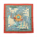 Hermès Carré 90 “Henry F. Smith Sailor” silk scarf with orange border, blue sea scene, sailing ships, and central crest motif.