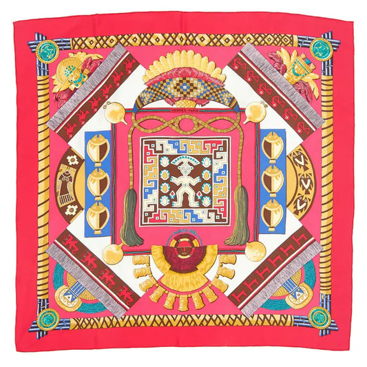 Hermès Carré 90 "HUACA PIRU" silk scarf in pink featuring vibrant geometric patterns, tribal figures, and ornamental details inspired by ancient Peruvian culture, bordered in bold pink.
