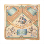 Hermès Carré 90 beige silk scarf with green, blue and gold equestrian motifs, horses, a mounted rider and ornate accessories.