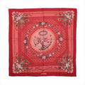 Hermès Carré 90 red cashmere-silk scarf with pink floral garlands, lattice pattern, green ornamental details and birds in a central medallion.