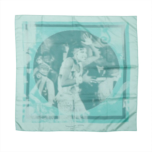 Hermès Carré 90 "JOSEPHINE DANSE" silk scarf in light blue featuring a stylized, pixelated portrait of Josephine Baker dancing, framed with a tonal blue border.