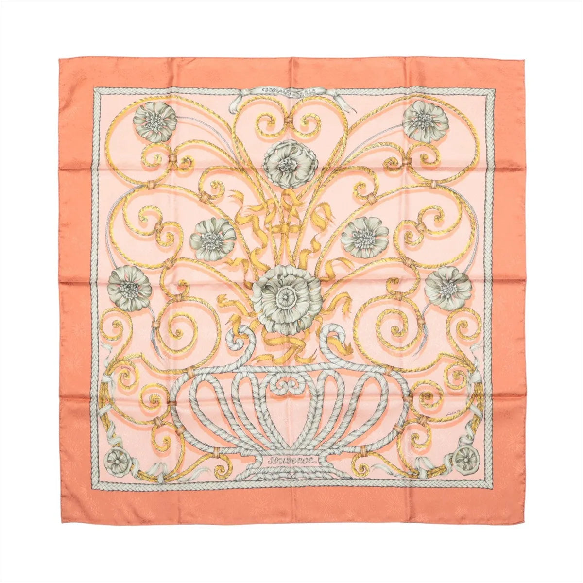 Hermès Carré 90 silk scarf in orange with pink center, gold scrollwork and floral motif, and orange border, laid flat