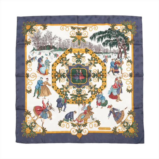 Hermès Carré 90 "Joies d’Hiver" silk scarf in navy blue, depicting vintage-style ice skaters in colorful winter clothing surrounded by gold and floral motifs.