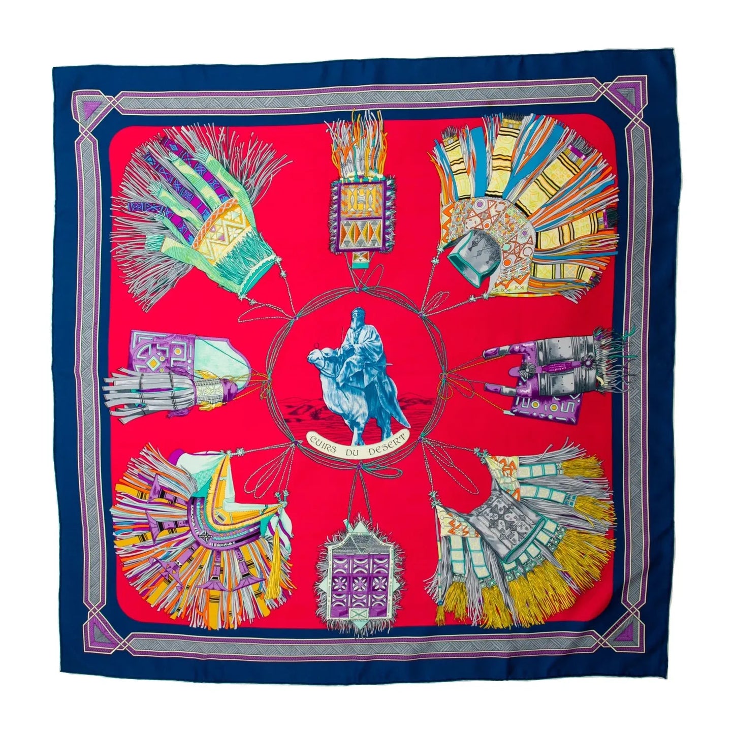 Hermès Carré 90 "Cuirs Du Desert" silk scarf featuring a red background with colorful desert-themed illustrations and a navy blue border, centered around a rider on a camel.