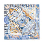 Hermès Carré 90 silk scarf in blue with multicolor abstract motif, black-and-white geometric border, and bird and fish illustrations, laid flat