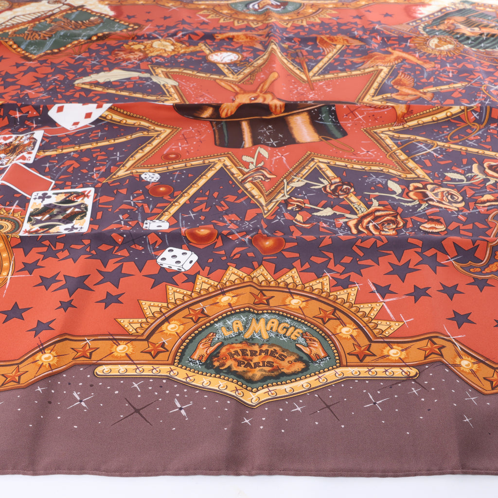 Hermès Carré 90 "LA MAGIE" Silk handkerchief in Brown