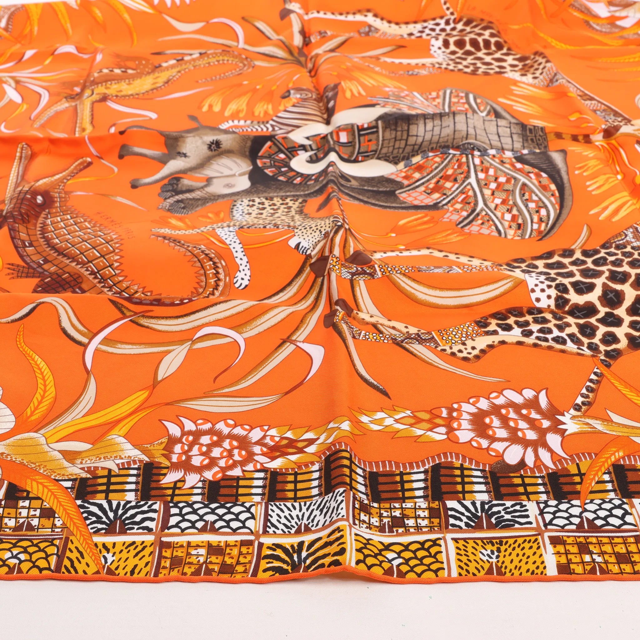 Hermès Carré 90 "LA MARCHE Du ZAMBEZE" Silk handkerchief in Orange
