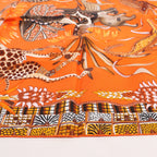 Hermès Carré 90 "LA MARCHE Du ZAMBEZE" Silk handkerchief in Orange
