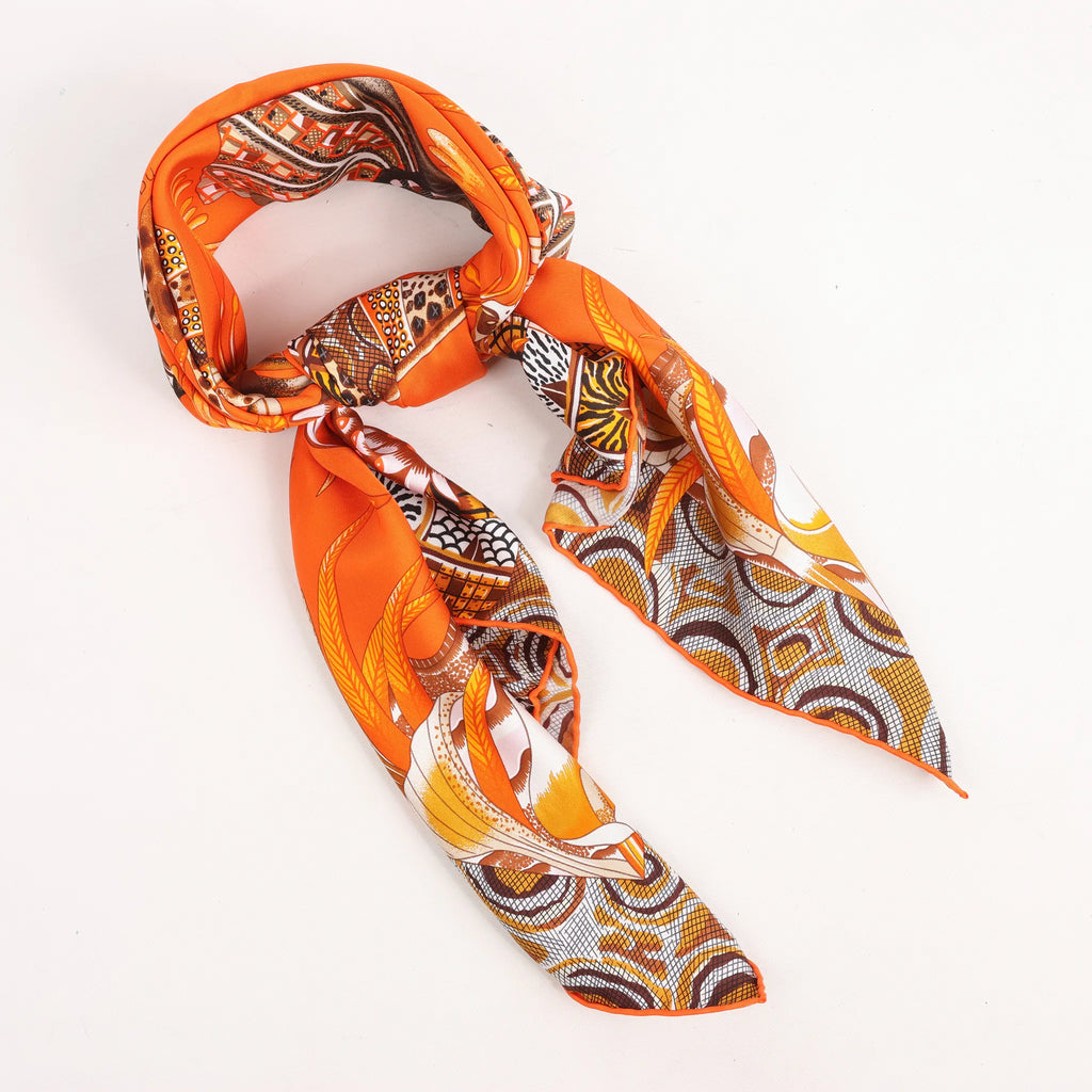 Hermès Carré 90 "LA MARCHE Du ZAMBEZE" Silk handkerchief in Orange