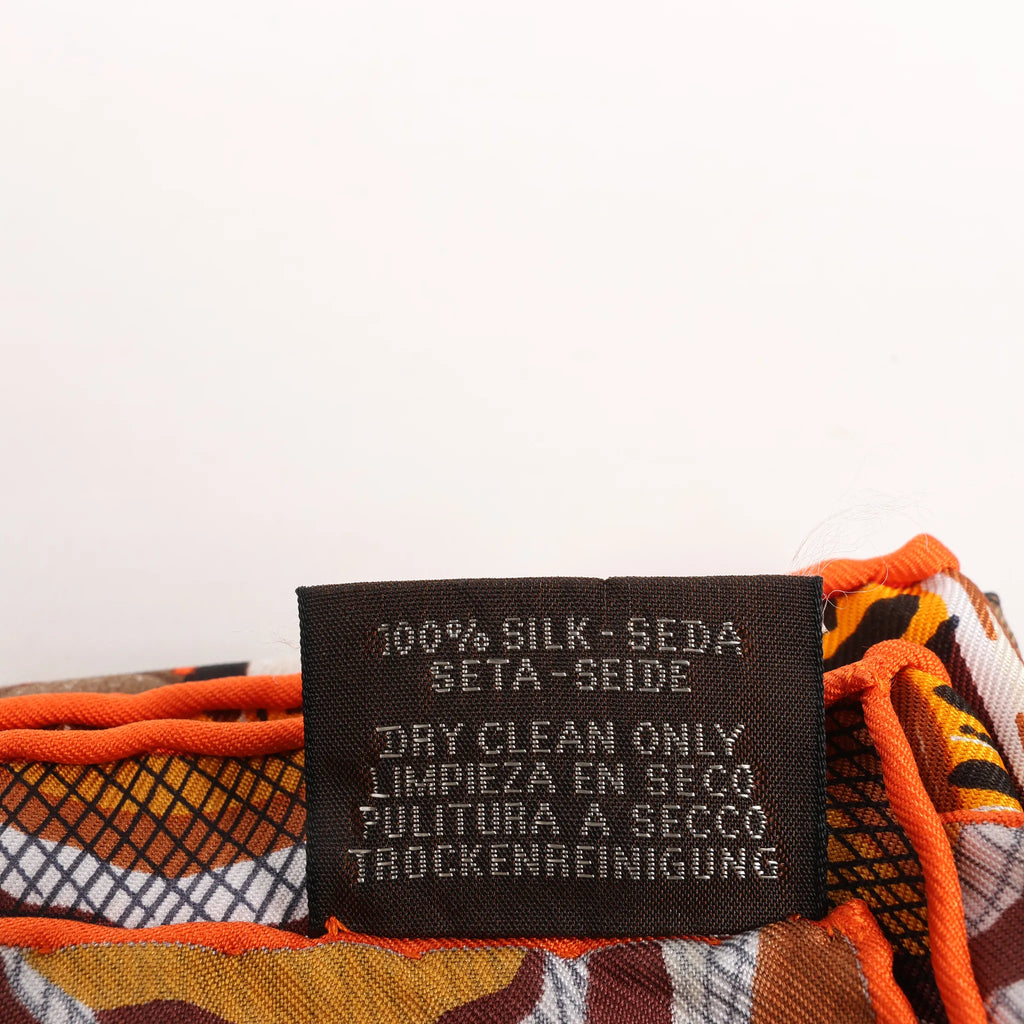 Hermès Carré 90 "LA MARCHE Du ZAMBEZE" Silk handkerchief in Orange