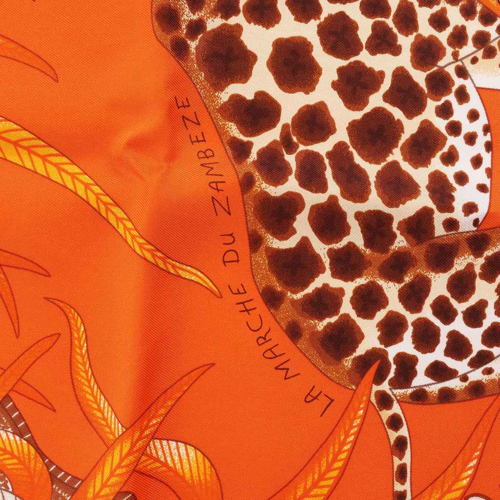 Hermès Carré 90 "LA MARCHE Du ZAMBEZE" Silk handkerchief in Orange