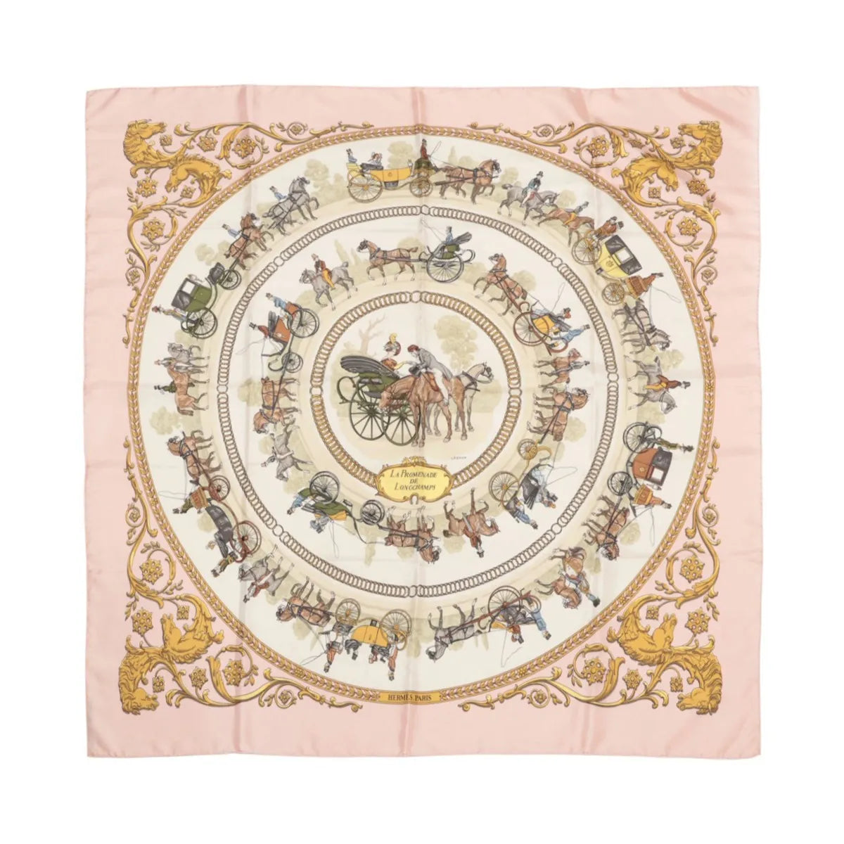 Hermès Carré 90 pink silk scarf with circular horse-drawn carriage illustrations, gold ornate border, and “Hermès Paris” text at bottom