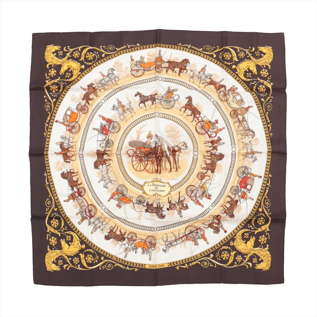 Hermès Carré 90 silk scarf titled "La Promenade de Longchamps," featuring concentric circles of detailed horse-drawn carriages and riders in brown, gold, and red tones on a cream background, framed by an ornate brown and gold border with lion motifs.