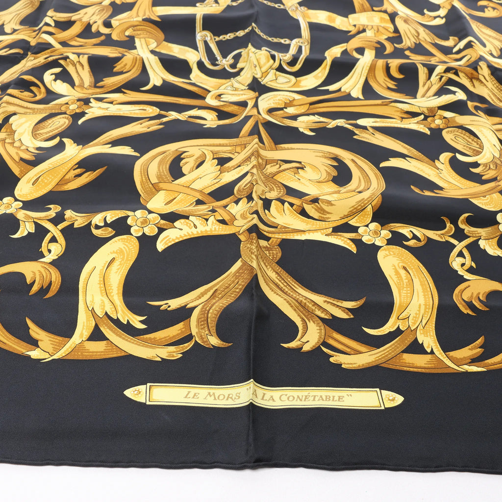 Hermès Carré 90 "LE MORS A LA CONETABLE" Silk handkerchief in Black x Gold