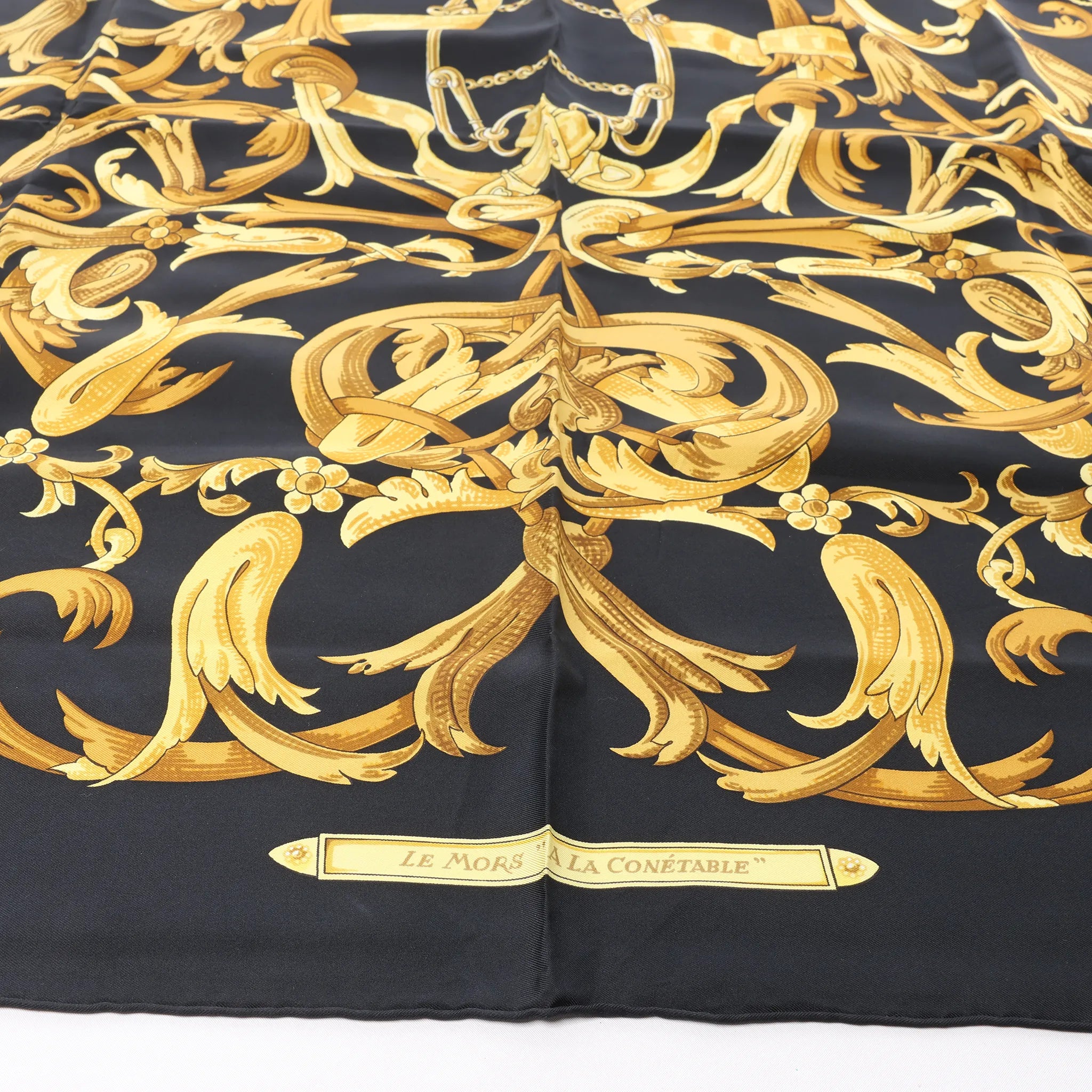 Hermès Carré 90 "LE MORS A LA CONETABLE" Silk handkerchief in Black x Gold