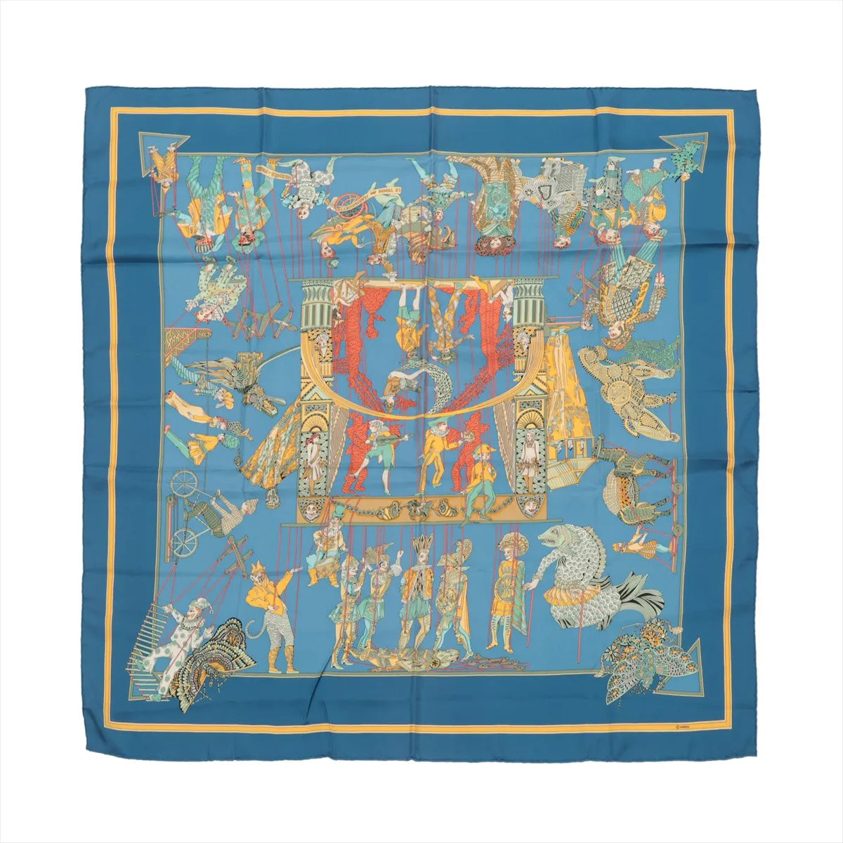Hermès Carré 90 blue silk scarf with marionette theatre illustration, figures around a central stage scene, and yellow border accents