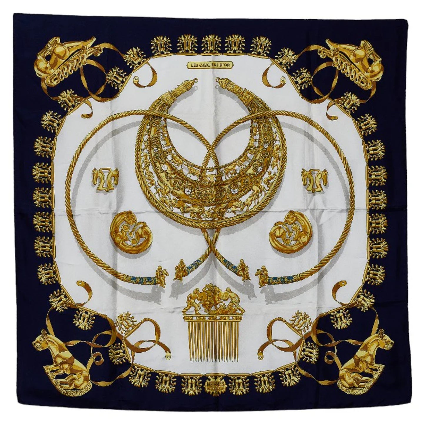 Hermès Carré 90 “Les Cavaliers d'Or” silk scarf in navy blue with a central gold motif of intertwined horse-themed ornaments, medallions, and regal details on a white background.