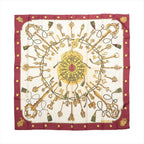 Hermès Carré 90 burgundy and ivory silk scarf with ornate gold key motifs, green tassels, a central circular medallion and burgundy border.