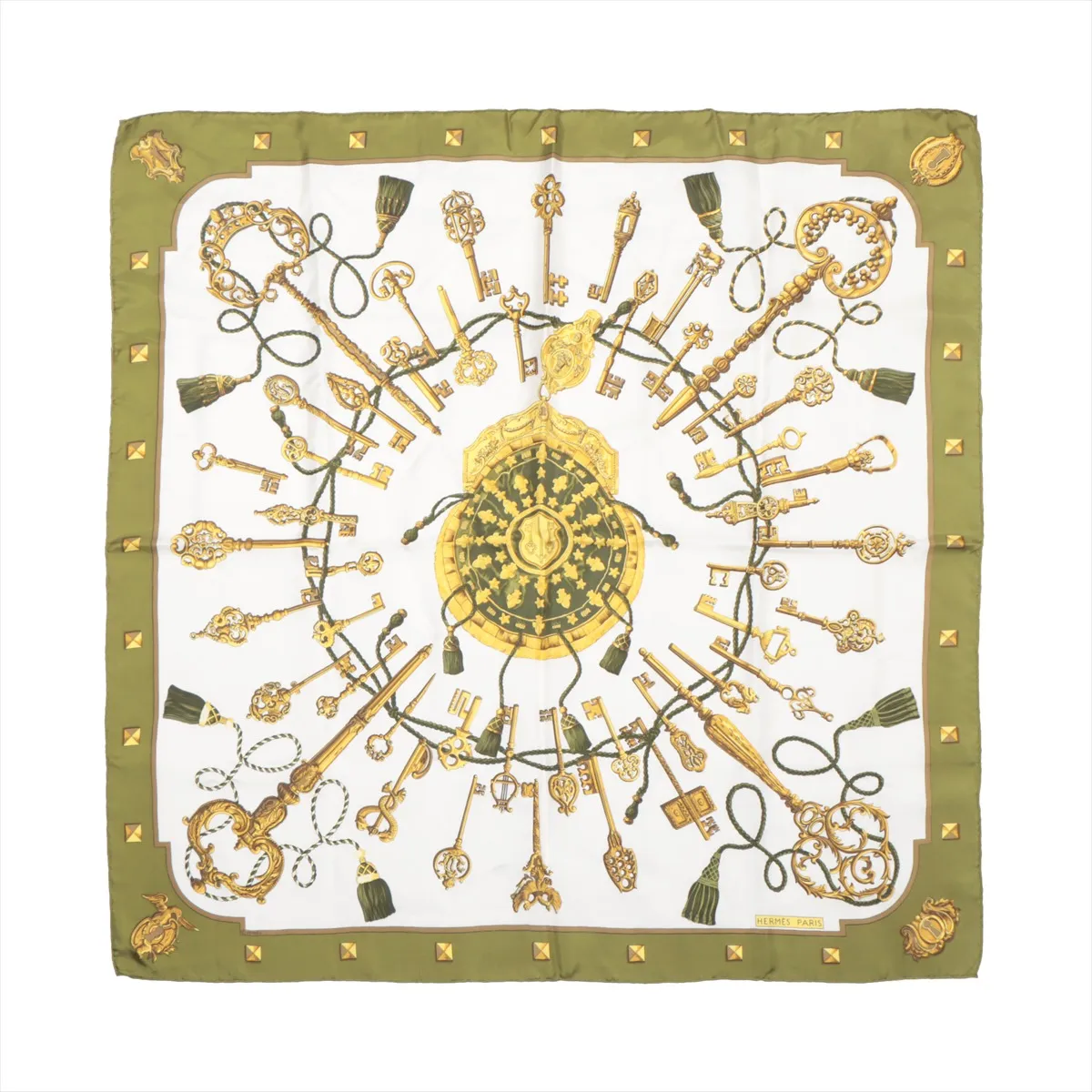 Hermès Carré 90 "LES CLÉS" silk handkerchief in khaki, featuring an elaborate circular arrangement of golden antique keys tied with green cords around a central medallion, bordered by gold studs and tassels on a khaki and white silk background.