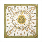 Hermès Carré 90 olive green and ivory silk scarf with ornate gold key motifs, green tassels, a central medallion and green border.