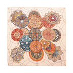Hermès Carré 90 silk scarf with multicolor ornate dome motifs on a light beige background, laid flat on white background.