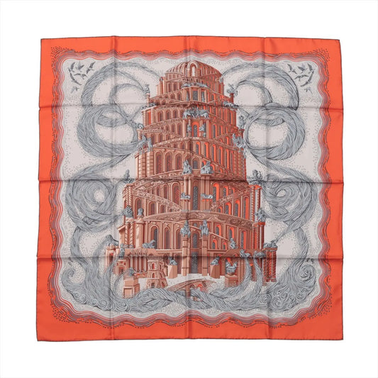 Hermès Carré 90 silk scarf in orange featuring the "Les Rivières de Babel" design with a towering architectural motif surrounded by swirling river illustrations.
