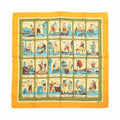 Hermès Carré 90 "L'Alphabet des Métiers" silk scarf in orange featuring illustrated alphabet blocks, each with a different traditional French profession, framed by a bold orange border.