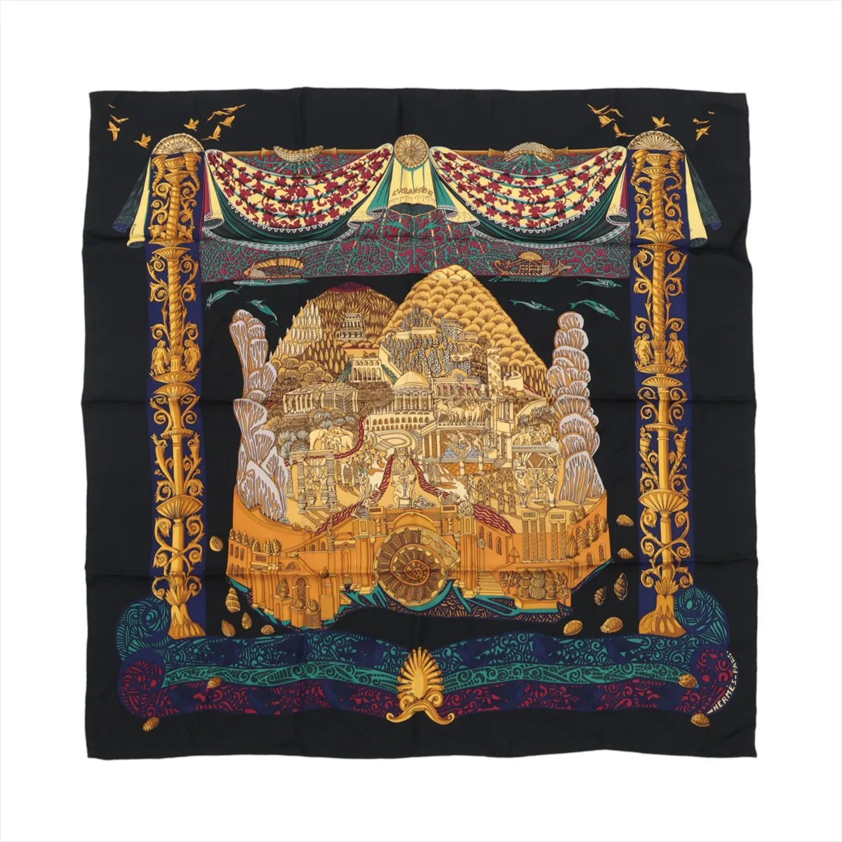 Hermès Carré 90 black silk scarf with gold illustrated city scene, ornate gold column border, and multicolor decorative band along the bottom edge.