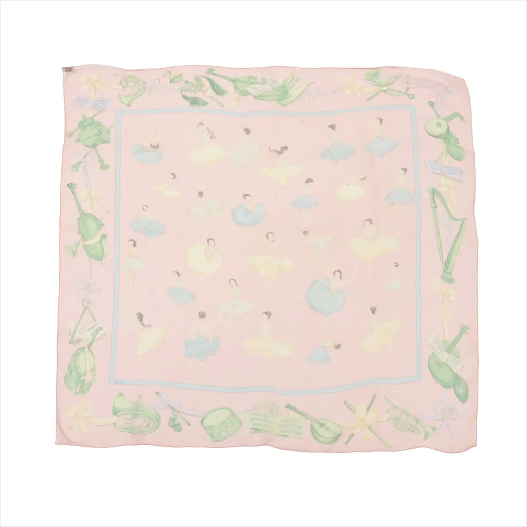 Hermès Carré 90 pink silk scarf with pastel ballet dancers pattern, light blue inner border, and illustrated green figure and instrument border, laid flat