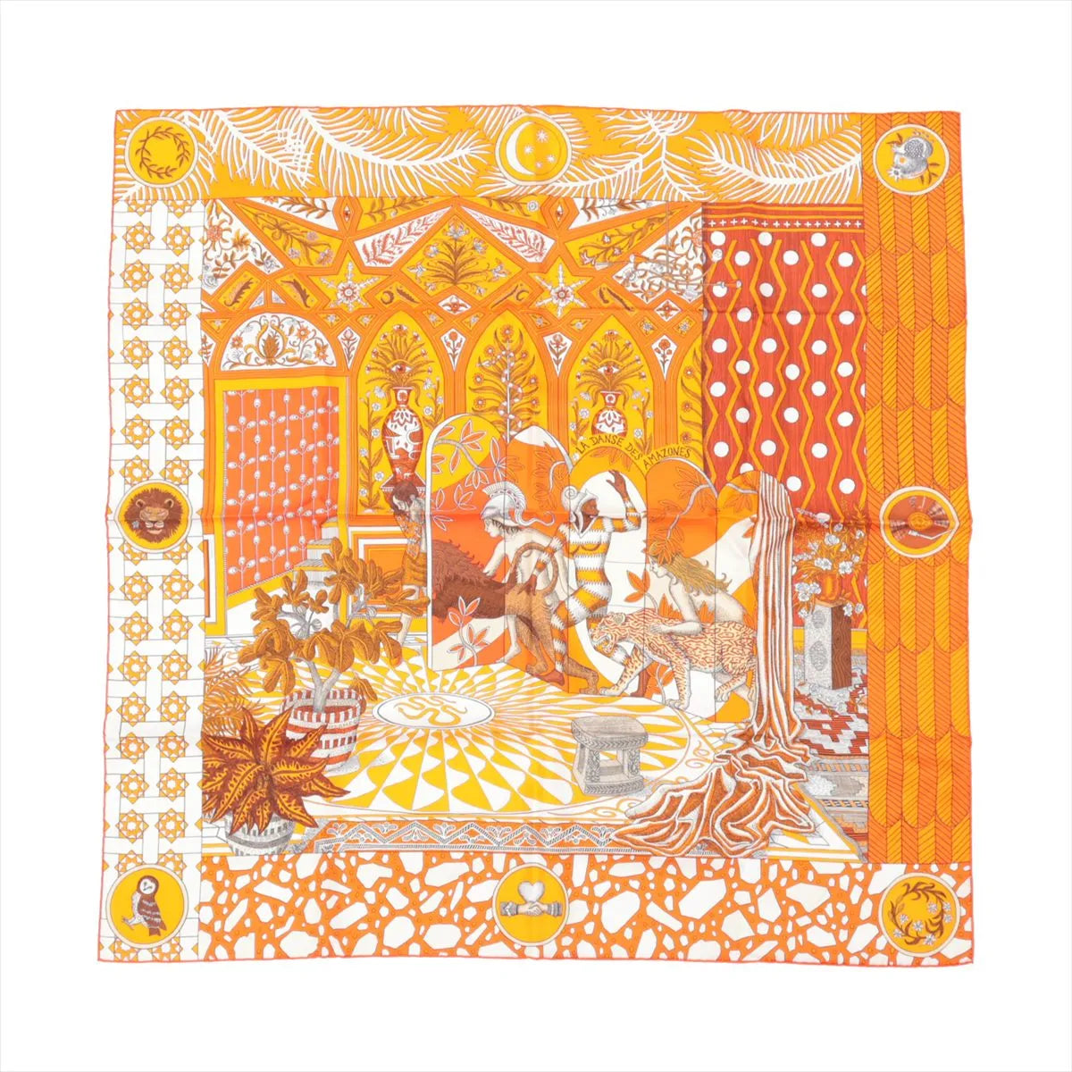 Hermès Carré 90 “La Danse des Amazones” silk scarf in orange, illustrating a vivid scene of Amazonian figures, leopards, and tropical plants within a patterned palace interior.