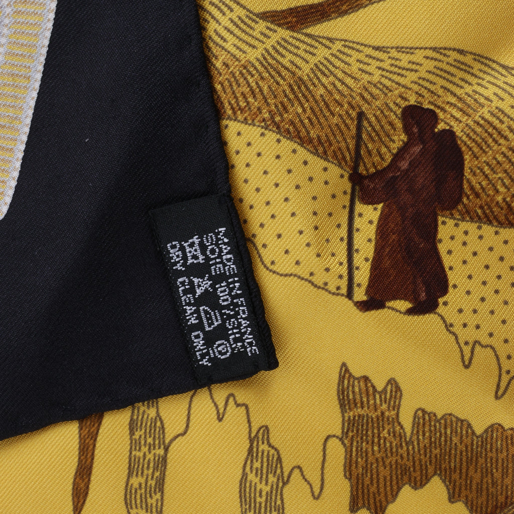 Hermès Carré 90 "La femme aux semelles de vent" Silk handkerchief in Brown x Black