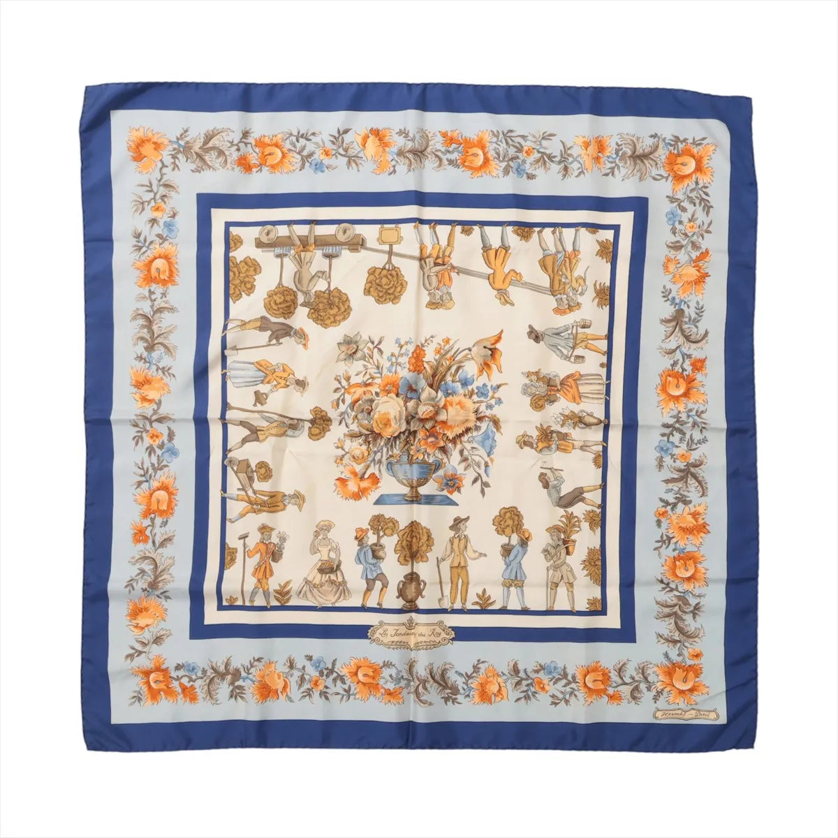 Blue Hermès Carré 90 silk scarf with orange floral border, illustrated garden figures and a large central flower arrangement.