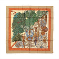 Hermès Carré 90 "Les Légendes de L'Arbre" silk scarf in beige with lush green trees, intricate forest motifs, and orange decorative border.