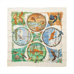 Ivory Hermès Carré 90 silk scarf with illustrated deer, birds, squirrels and seasonal woodland scenes in circular panels.
