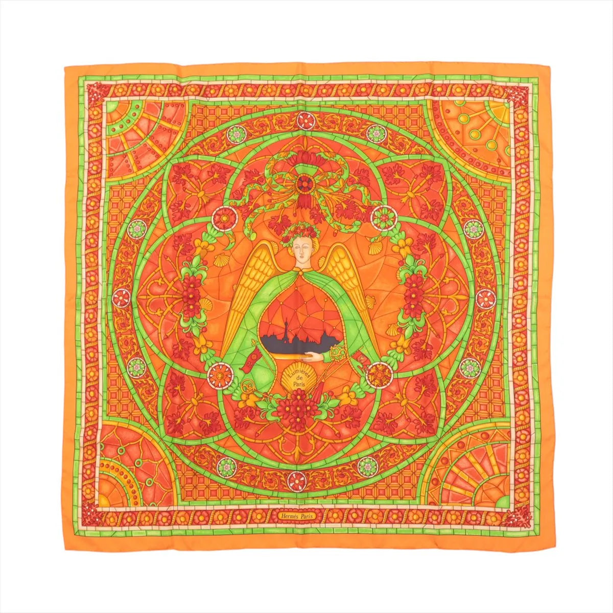 Hermès Carré 90 orange silk scarf with stained-glass style design featuring a central winged figure, green scrollwork, and intricate floral and geometric border details.