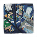 Navy blue Hermès square scarf with illustrated interior scene featuring a staircase, fireplace, bookshelf, furniture and animal motifs.