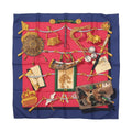 Hermès Carré 90 “Mémoire d’Hermès” silk scarf with navy border, red center, and illustrated objects including equestrian details, cords, and framed items.
