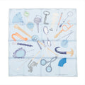 Hermès Carré 90 silk scarf in light blue with illustrated objects and accessories in pastel tones, laid flat on white background.